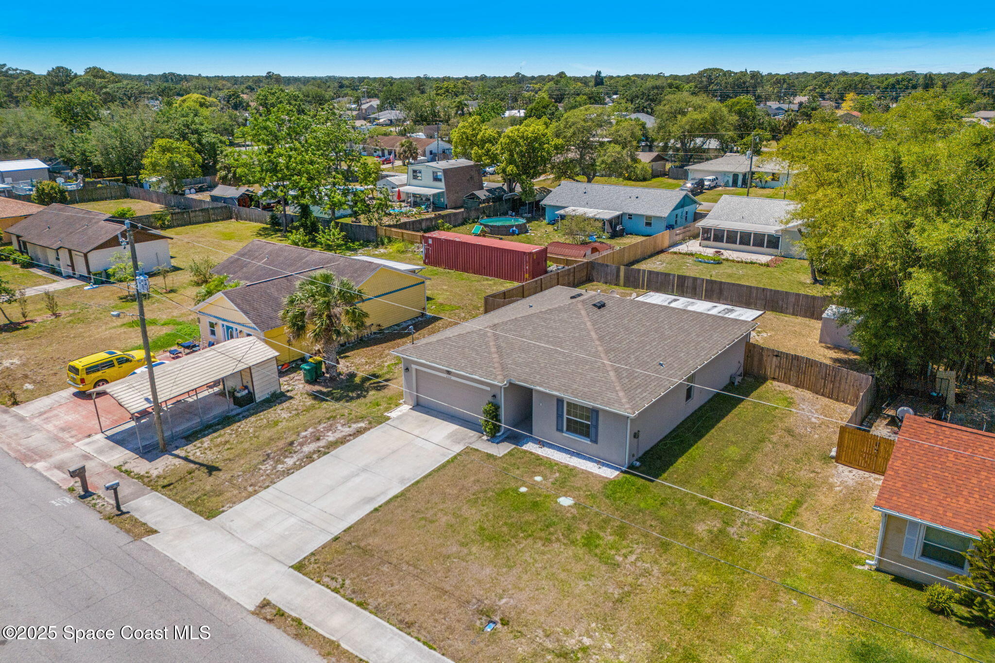6162 Rena Avenue Cocoa, FL 32927 - Photo 33 of 42 an aerial view of a house with swimming pool and ocean view
