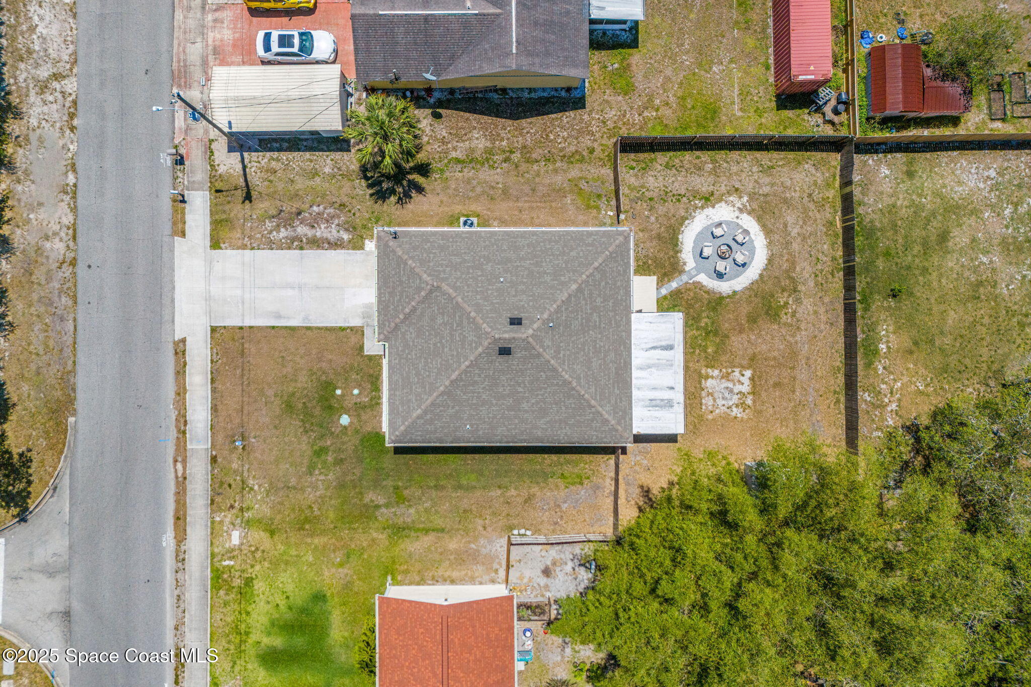 6162 Rena Avenue Cocoa, FL 32927 - Photo 35 of 42 a aerial view of a brick house with a yard