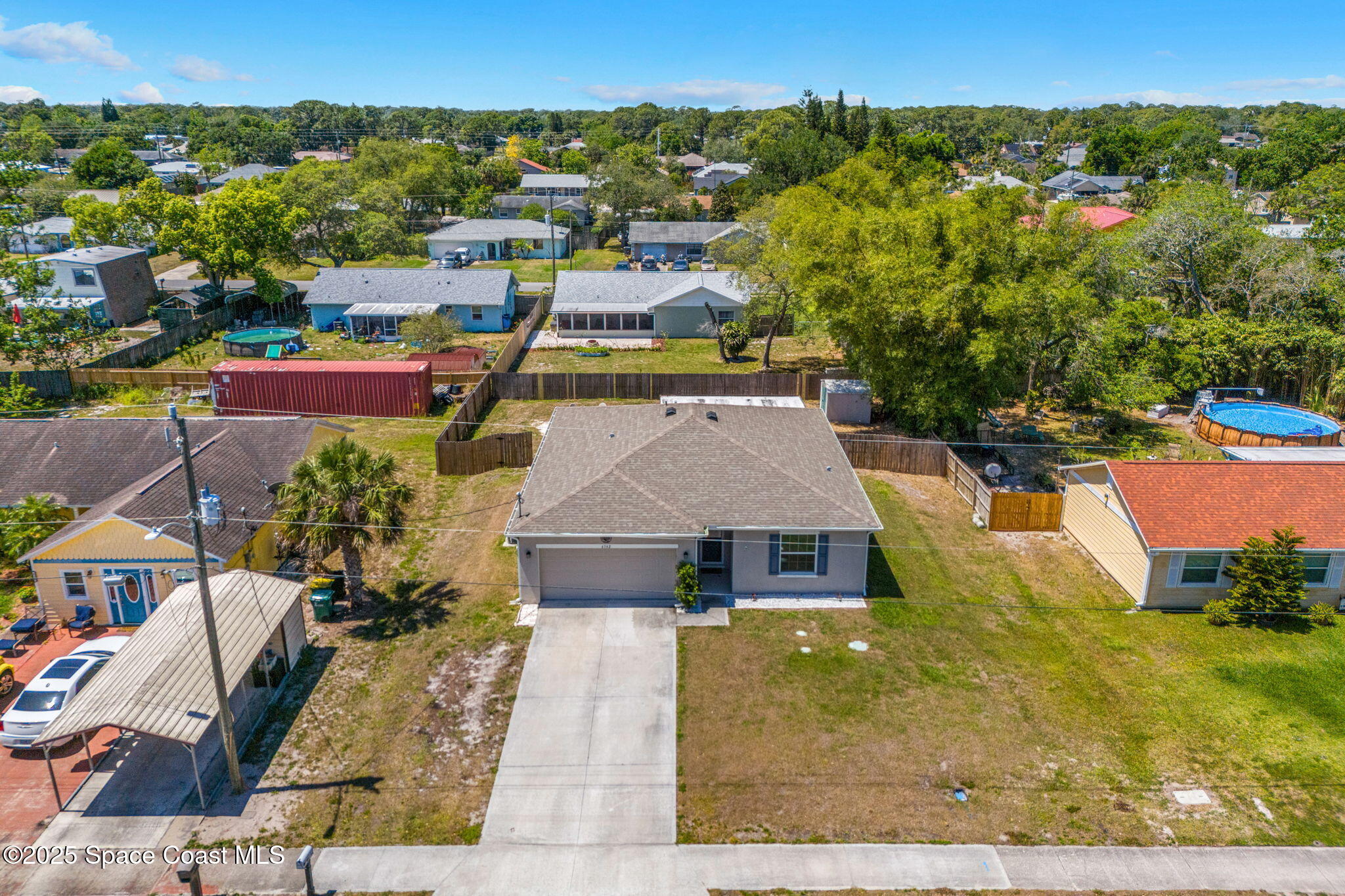 6162 Rena Avenue Cocoa, FL 32927 - Photo 37 of 42 an aerial view of a house with a yard pool outdoor seating and yard
