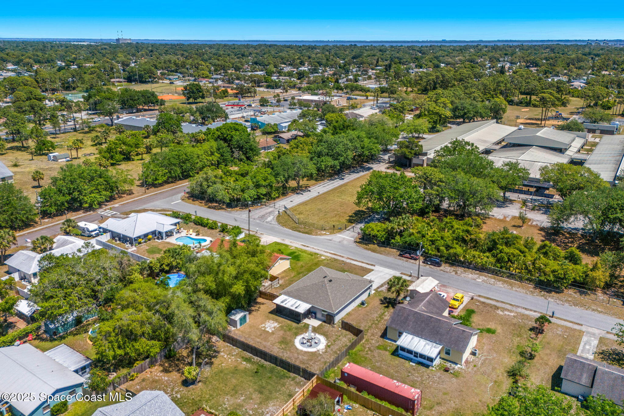 6162 Rena Avenue Cocoa, FL 32927 - Photo 39 of 42 an aerial view of a city with lots of residential buildings and mountain view in back