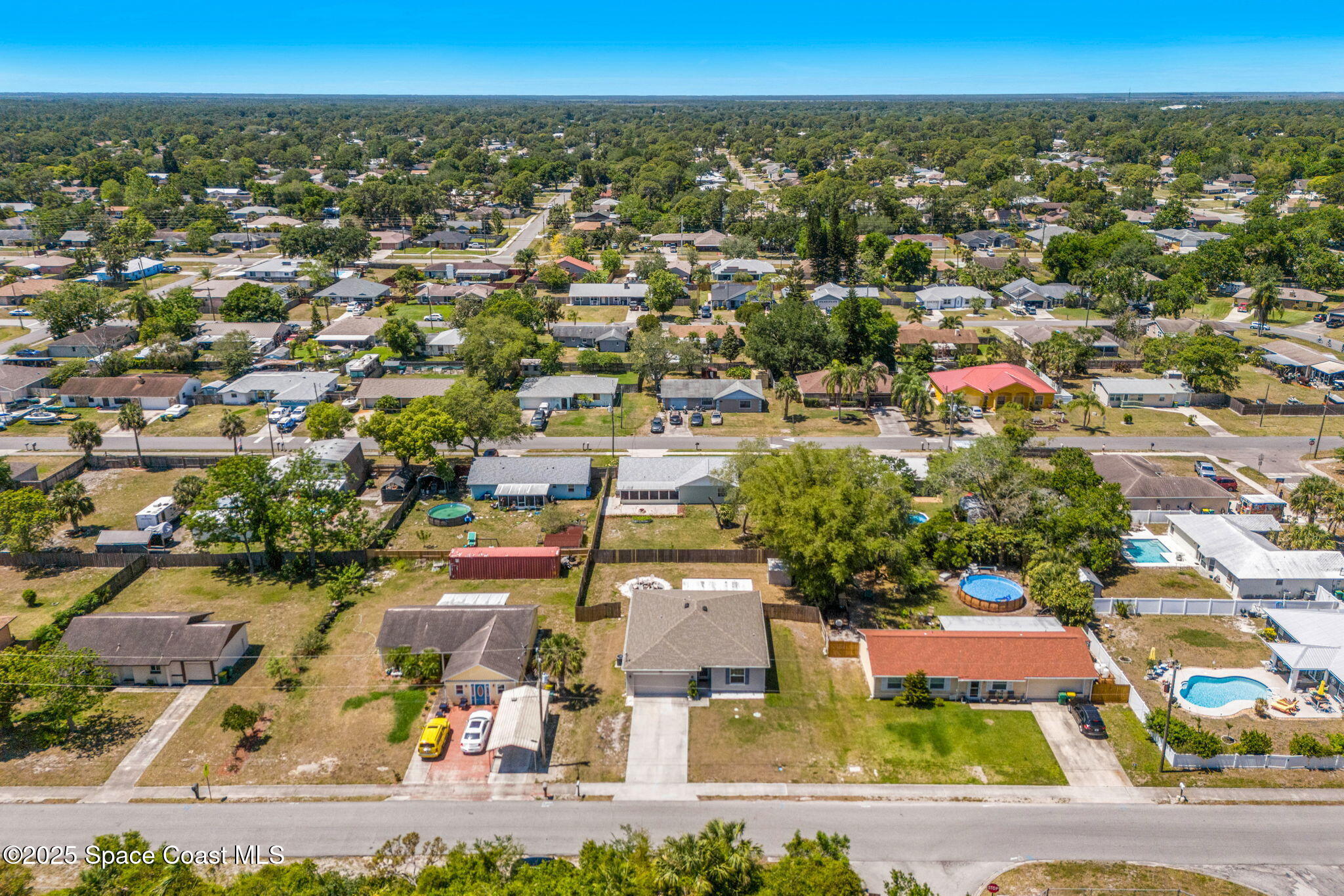 6162 Rena Avenue Cocoa, FL 32927 - Photo 41 of 42 an aerial view of residential houses with outdoor space and parking