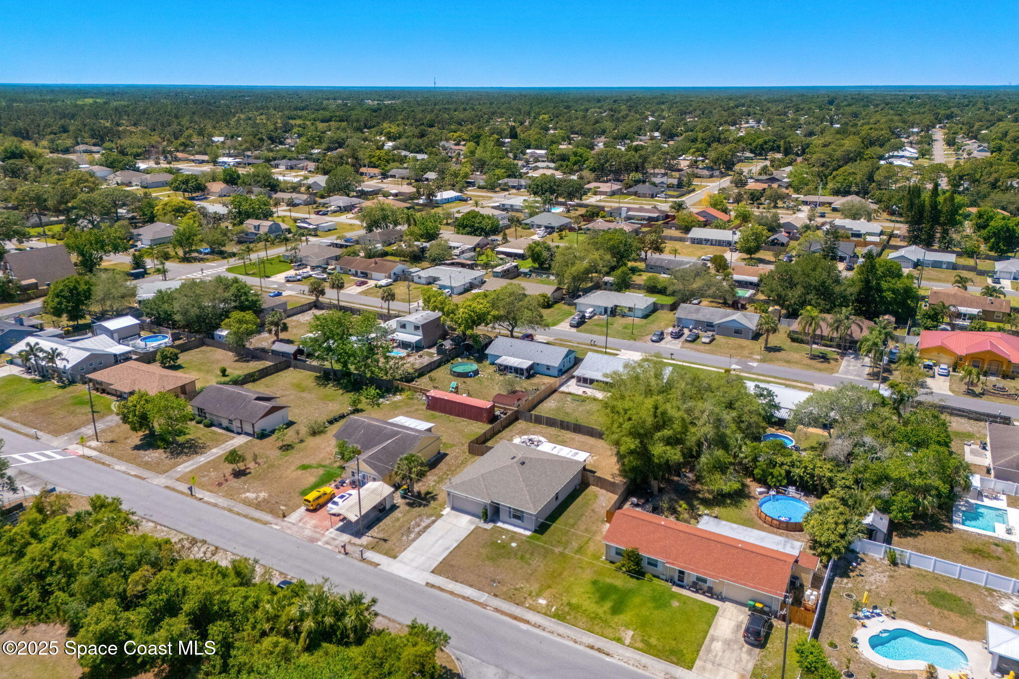 6162 Rena Avenue Cocoa, FL 32927 - Photo 42 of 42 an aerial view of residential houses with outdoor space and trees