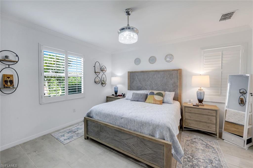 2193 Clementine Street Naples, FL 34120 - Photo 16 of 36 a bedroom with bed and a window