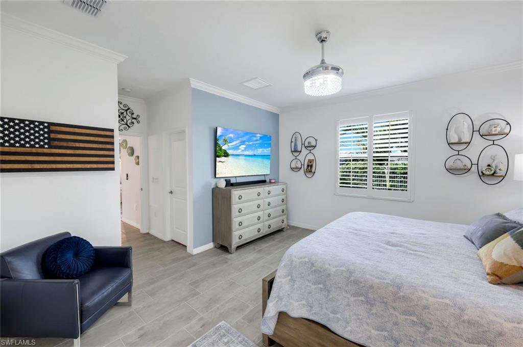 2193 Clementine Street Naples, FL 34120 - Photo 17 of 36 a bedroom with furniture and a window