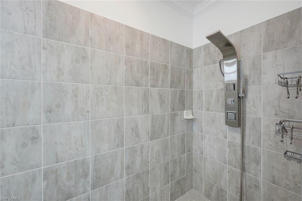 2193 Clementine Street Naples, FL 34120 - Photo 19 of 36 a bathroom with a shower