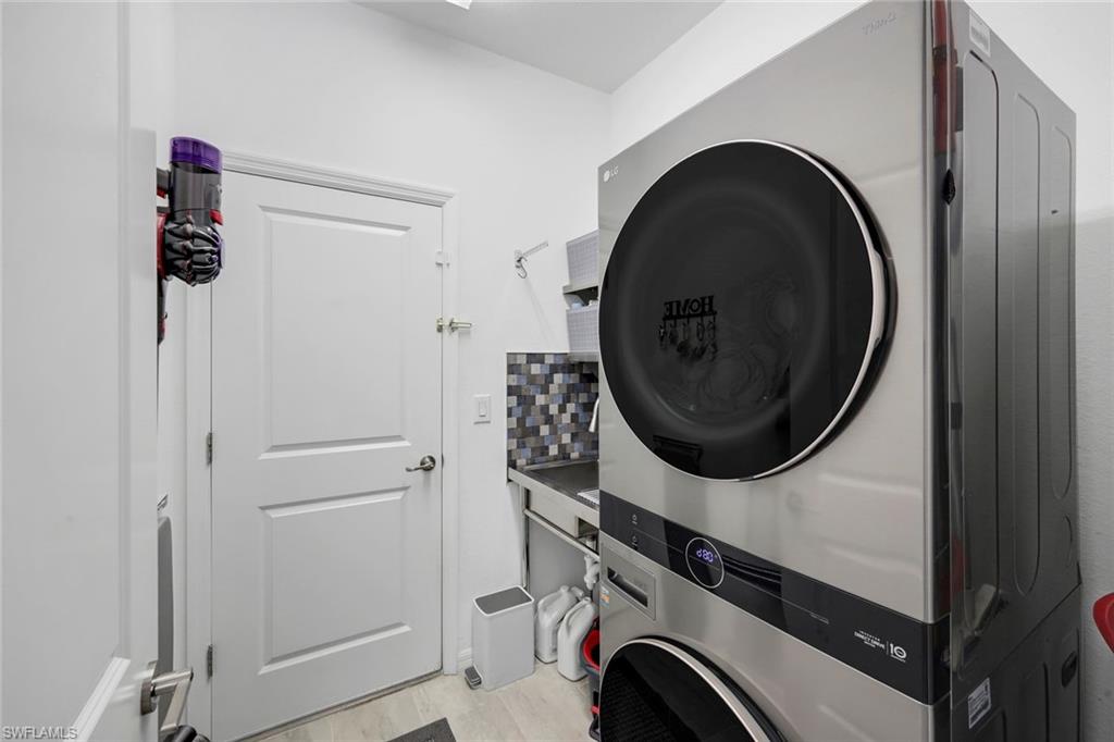 2193 Clementine Street Naples, FL 34120 - Photo 25 of 36 a view of a storage & utility room with dryer and washer