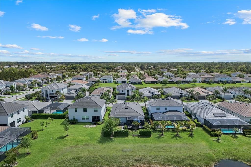 2193 Clementine Street Naples, FL 34120 - Photo 31 of 36 a view of a house with a yard