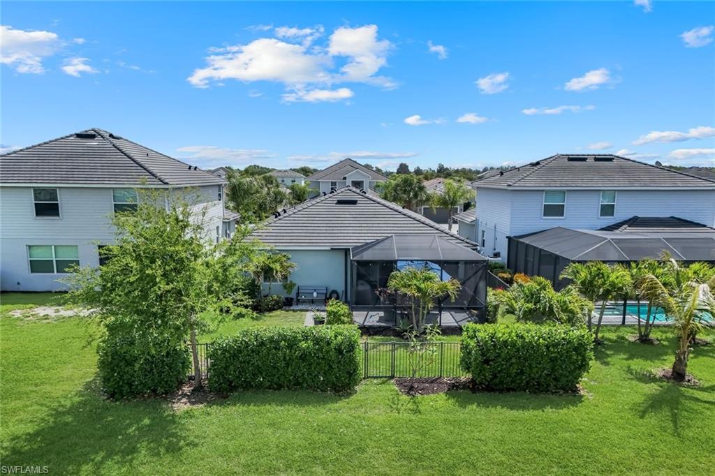 2193 Clementine Street Naples, FL 34120 - Photo 33 of 36 a front view of a house with a yard