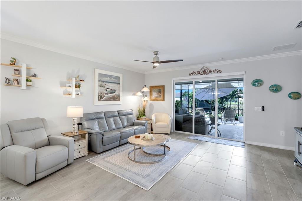 2193 Clementine Street Naples, FL 34120 - Photo 5 of 36 a living room with furniture and a large window