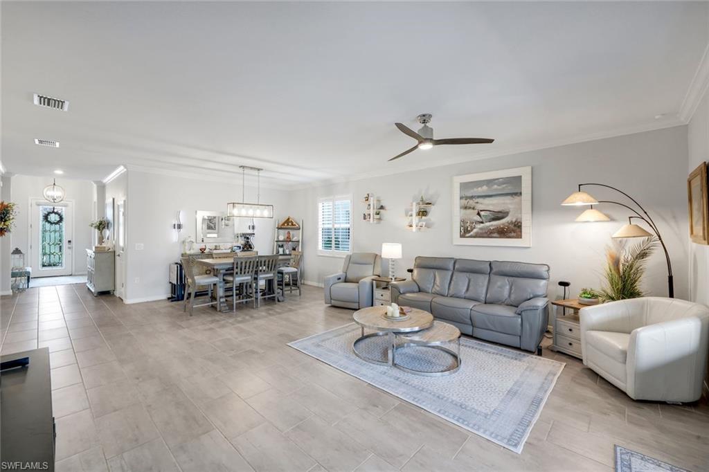 2193 Clementine Street Naples, FL 34120 - Photo 7 of 36 a living room with furniture and a large window