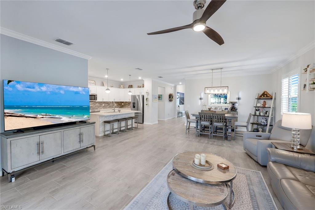 2193 Clementine Street Naples, FL 34120 - Photo 8 of 36 a living room with furniture and a kitchen