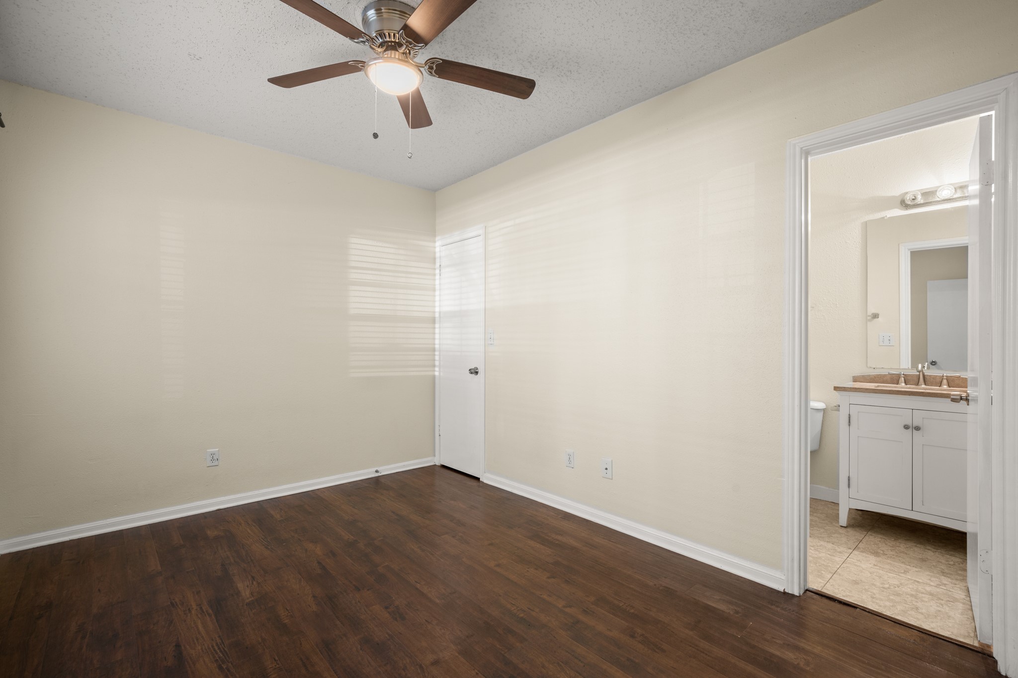 712 West 21st Street, Unit 101 Austin, TX 78705 - Photo 12 of 17 wooden floor in an empty room