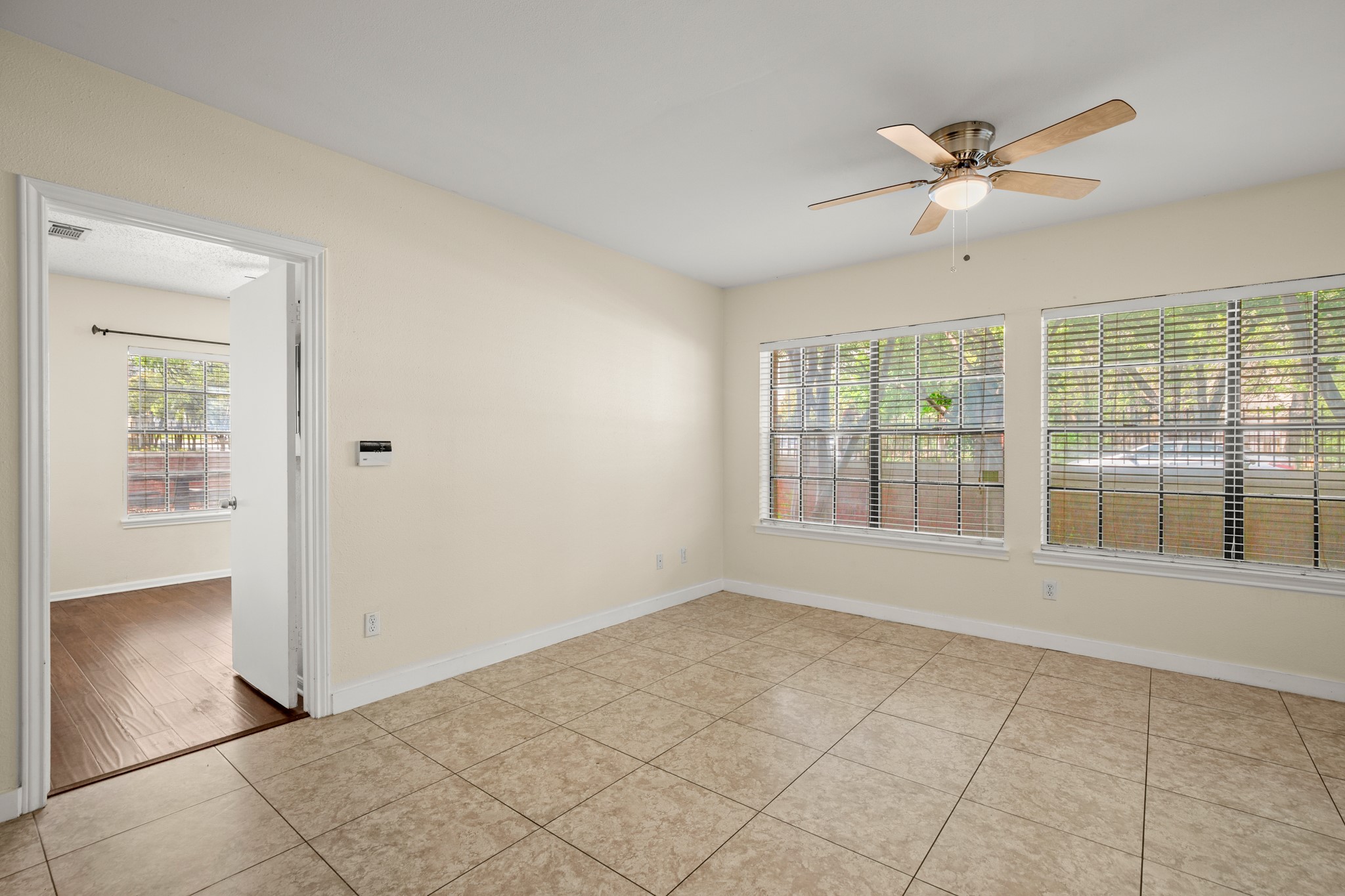 712 West 21st Street, Unit 101 Austin, TX 78705 - Photo 4 of 17 a view of an empty room with a window