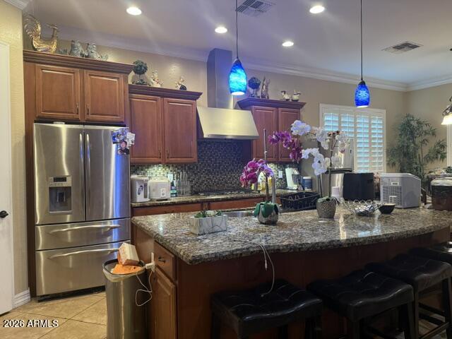 16121 West Berkeley Road Goodyear, AZ 85395 - Photo 10 of 20 a kitchen with stainless steel appliances granite countertop a refrigerator and a sink