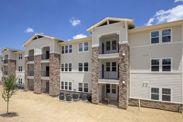 a front view of a house with glass windows