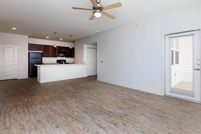 a kitchen with a refrigerator stove and microwave
