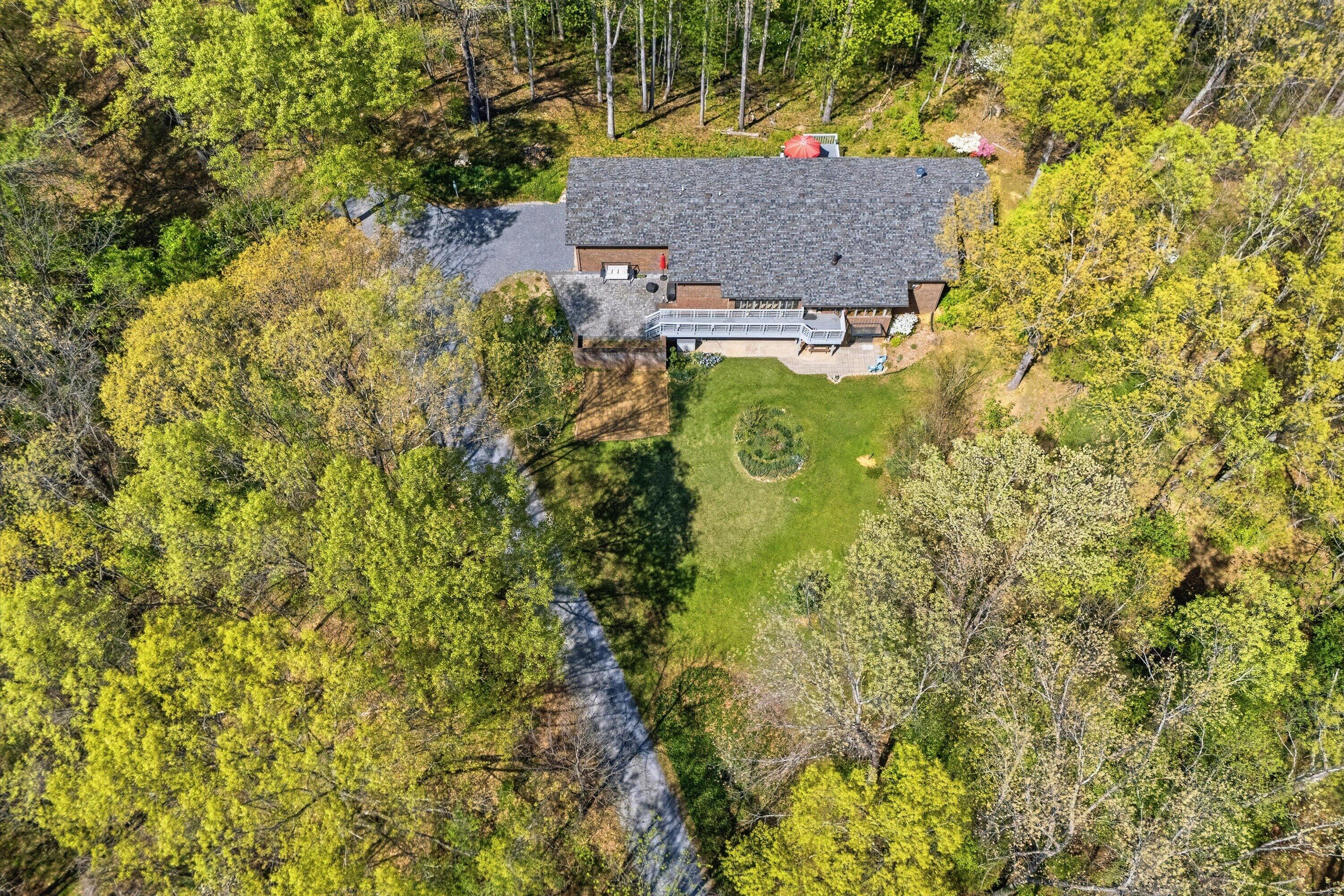 1124 Old Hollow Road Buchanan, VA 24066 - Photo 60 of 73 a aerial view of house with yard and trees in the background