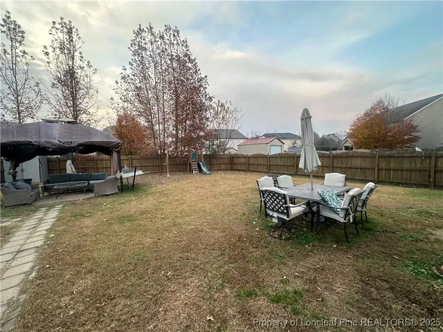 a view of a lake with outdoor seating