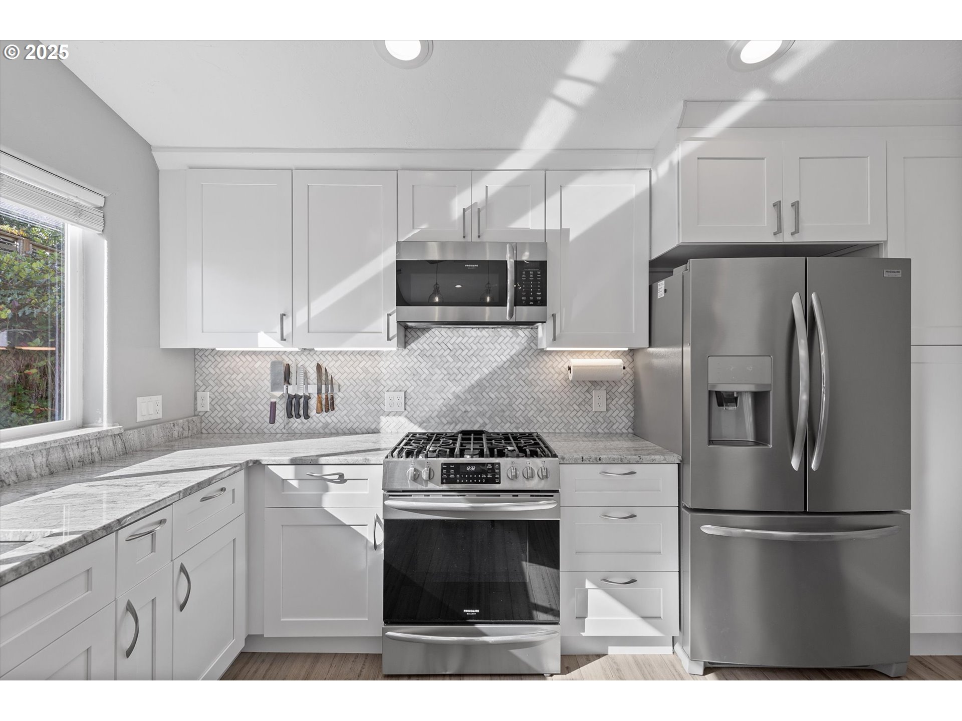 3635 Sea Mist Avenue Depoe Bay, OR 97341 - Photo 12 of 38 a kitchen with stainless steel appliances a refrigerator stove and microwave