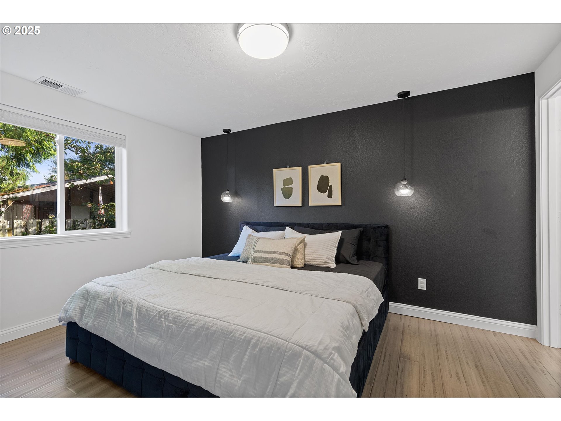 3635 Sea Mist Avenue Depoe Bay, OR 97341 - Photo 15 of 38 a bedroom with a large bed and a large window