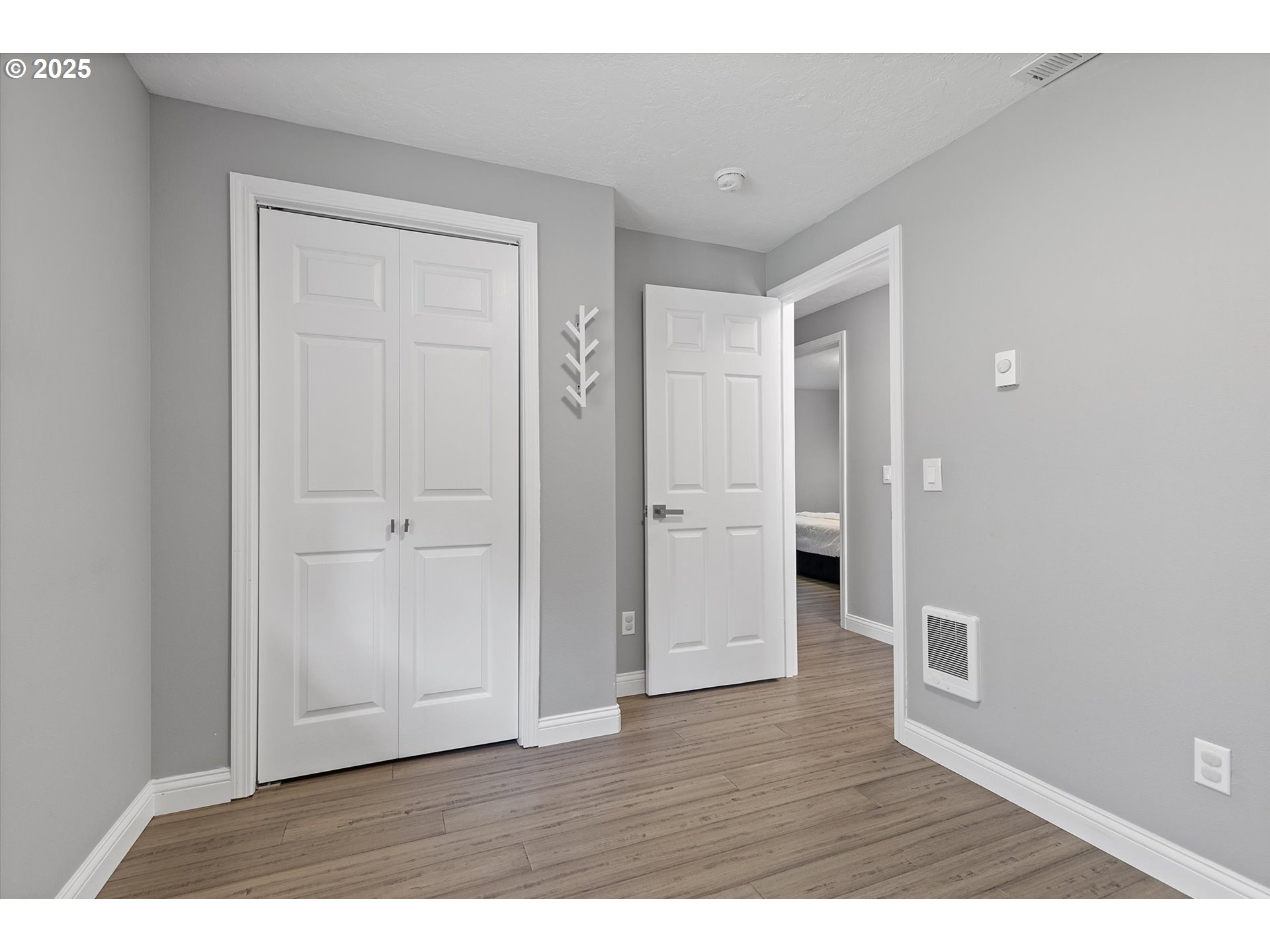 3635 Sea Mist Avenue Depoe Bay, OR 97341 - Photo 21 of 38 a view of an empty room and wooden floor