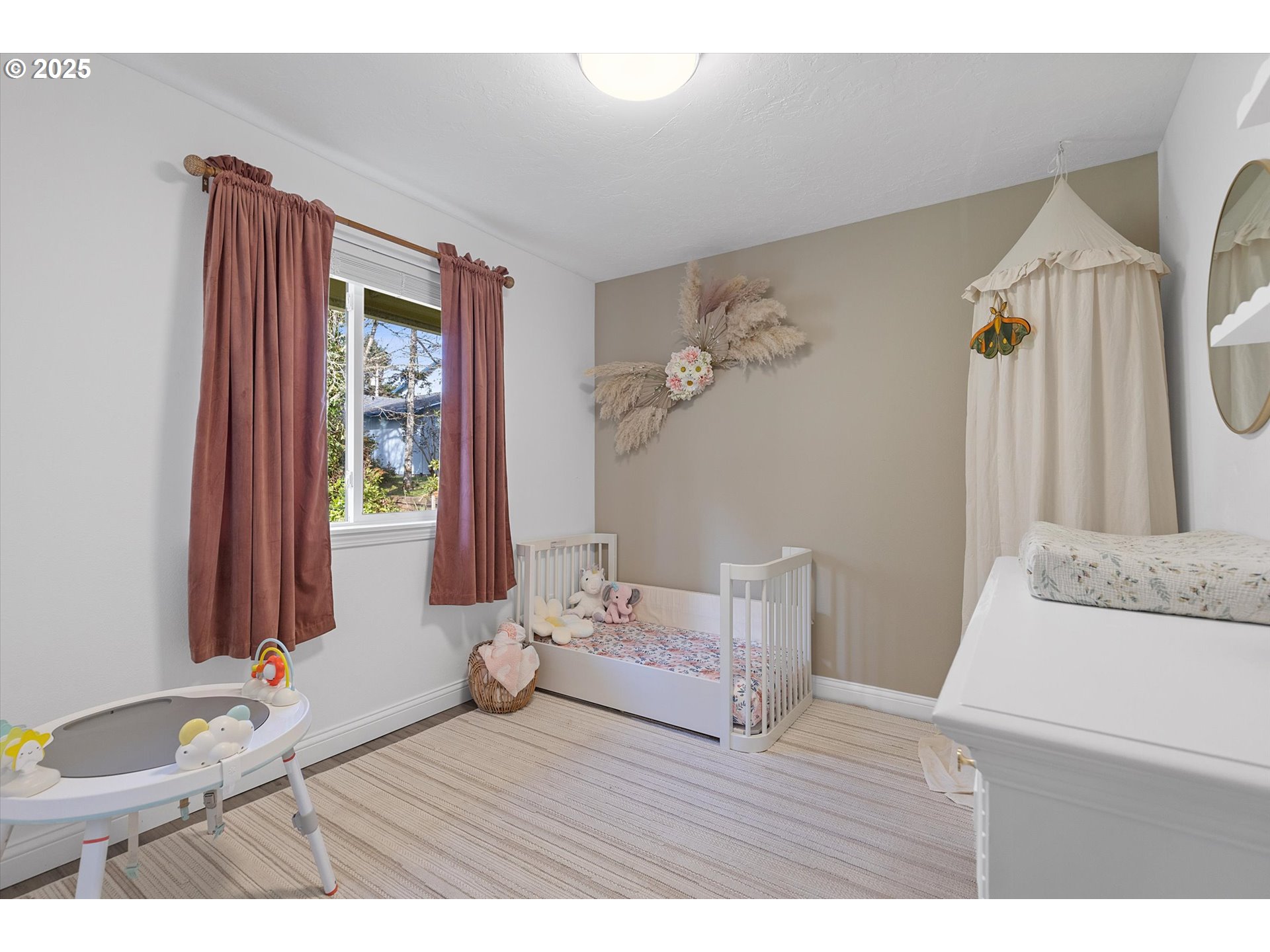 3635 Sea Mist Avenue Depoe Bay, OR 97341 - Photo 22 of 38 a bedroom with a bed and a wooden floor