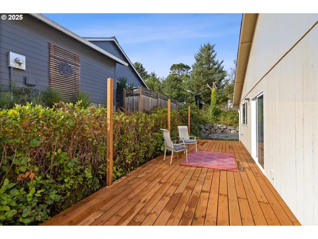 a backyard of a house with outdoor seating
