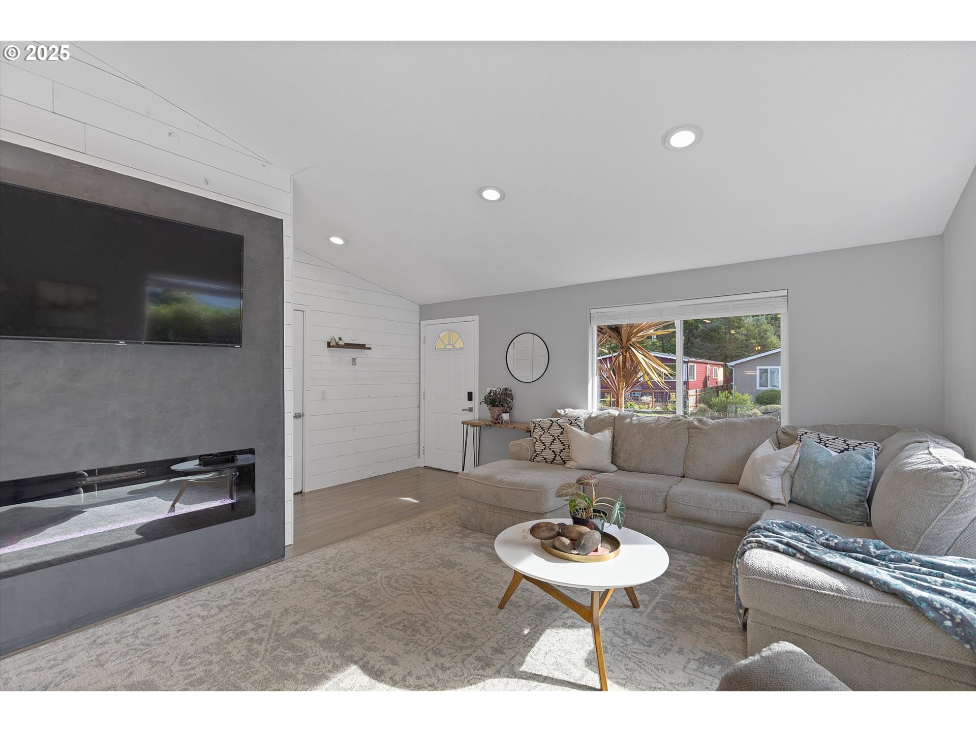 3635 Sea Mist Avenue Depoe Bay, OR 97341 - Photo 7 of 38 a living room with furniture and a flat screen tv