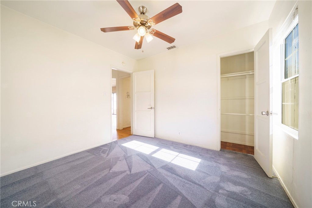 5446 Columbus Avenue Sherman Oaks, CA 91411 - Photo 17 of 31 an empty room with closet and a ceiling fan