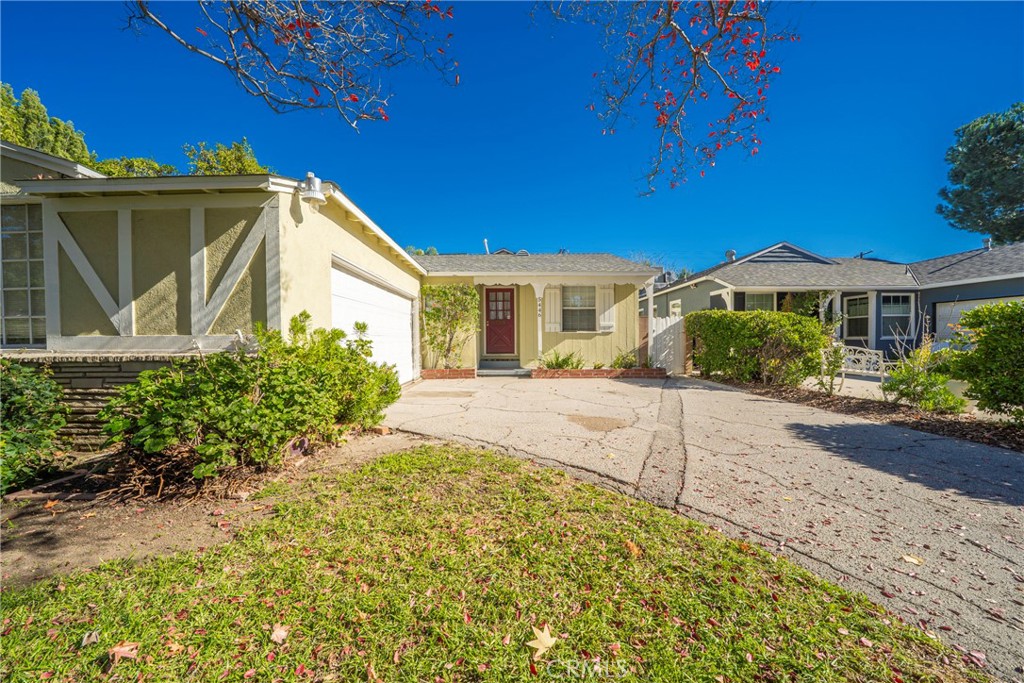 5446 Columbus Avenue Sherman Oaks, CA 91411 - Photo 2 of 31 a front view of a house with a yard