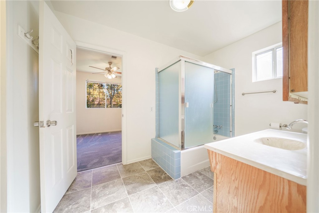 5446 Columbus Avenue Sherman Oaks, CA 91411 - Photo 21 of 31 a bathroom with a sink and a mirror