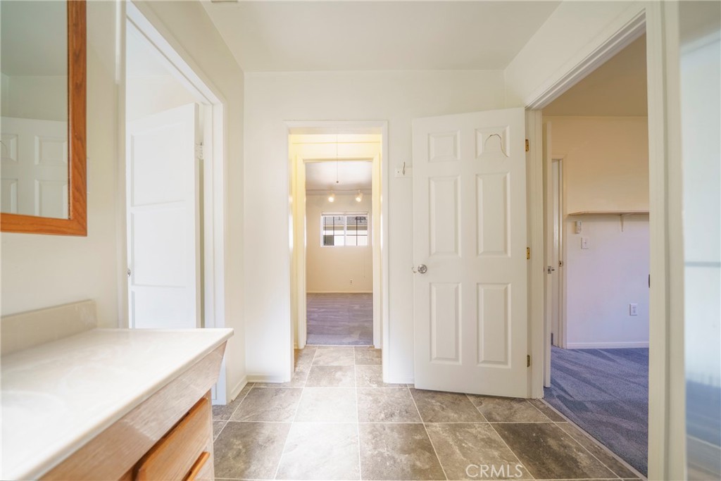 5446 Columbus Avenue Sherman Oaks, CA 91411 - Photo 23 of 31 a view of a bathroom with a sink and a mirror