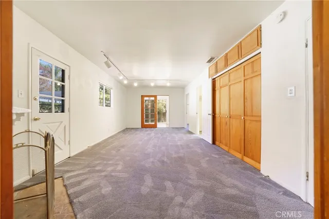 a view of a hallway with windows