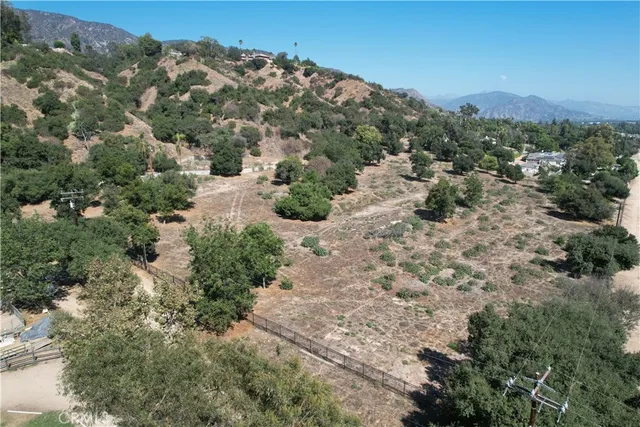 an aerial view of house with mountain view