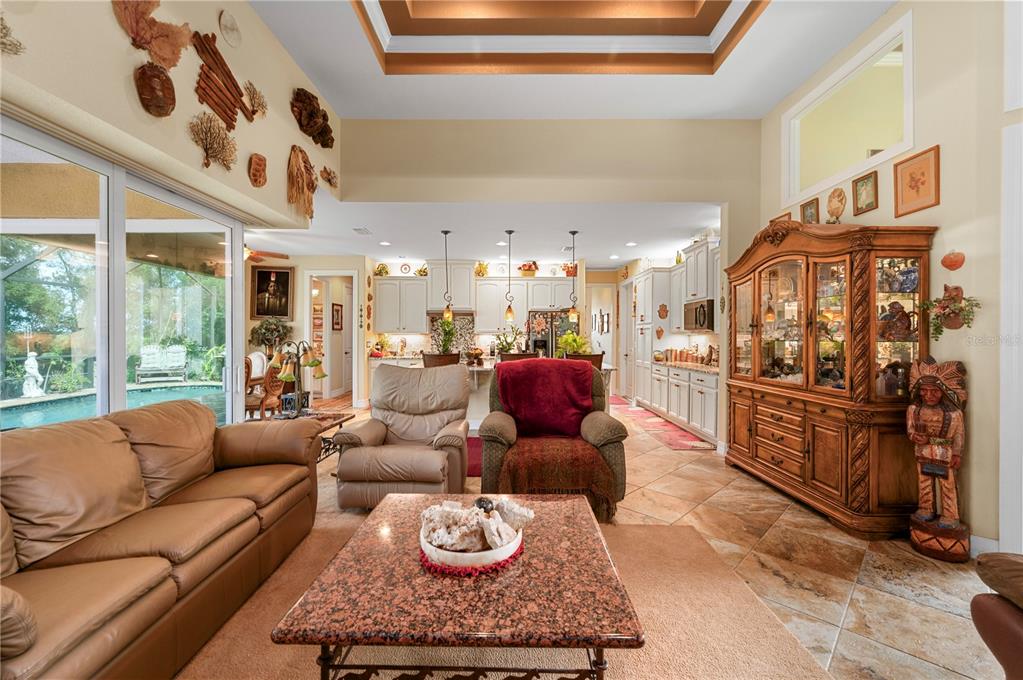 38881 Washington Loop Road Punta Gorda, FL 33982 - Photo 13 of 63 a living room with furniture kitchen view and a large window