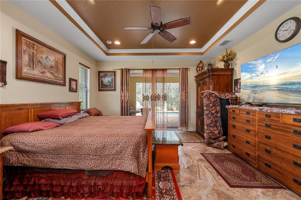 38881 Washington Loop Road Punta Gorda, FL 33982 - Photo 21 of 63 a bedroom with a bed dresser and a large window