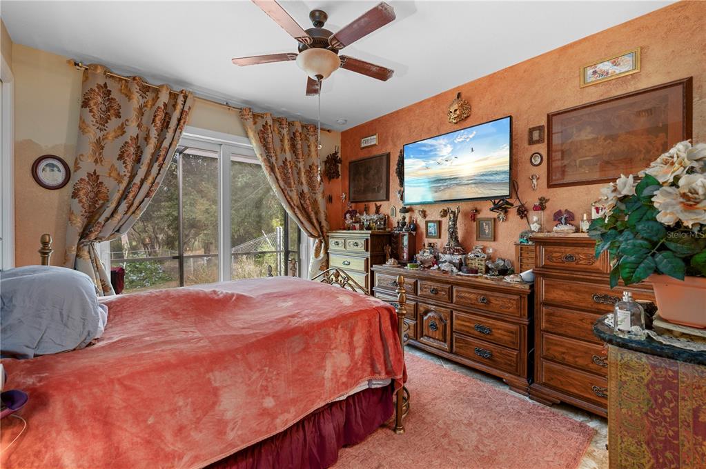 38881 Washington Loop Road Punta Gorda, FL 33982 - Photo 29 of 63 a bed room with a bed and a large window