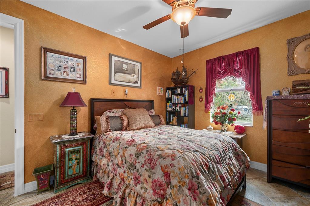 38881 Washington Loop Road Punta Gorda, FL 33982 - Photo 32 of 63 a bed sitting in a bedroom next to a window