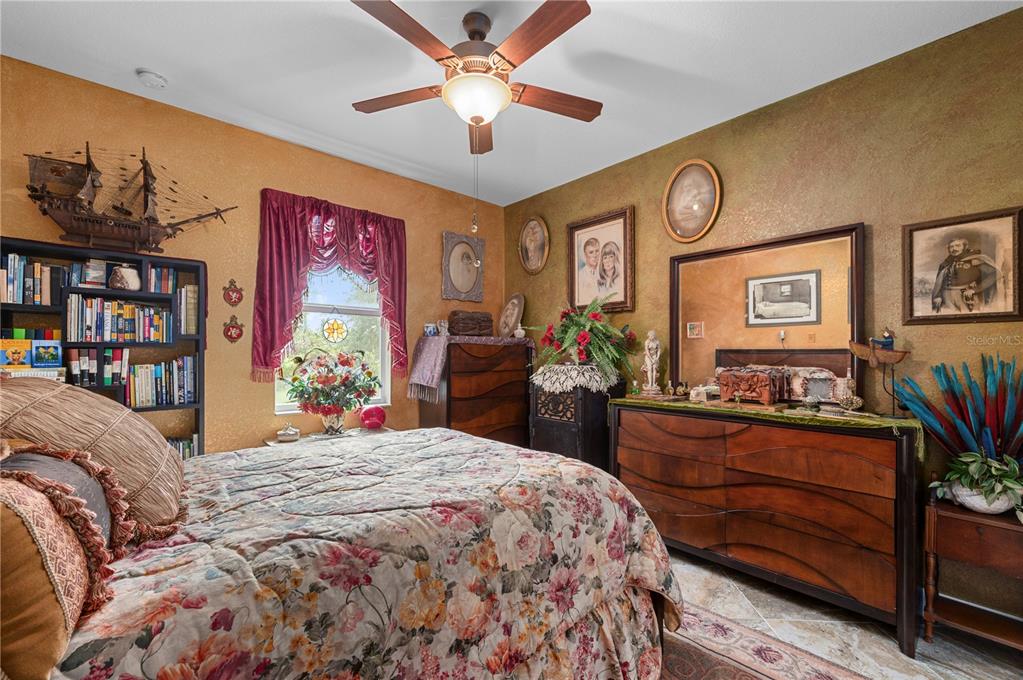 38881 Washington Loop Road Punta Gorda, FL 33982 - Photo 33 of 63 a bed room with a bed mirror and a window