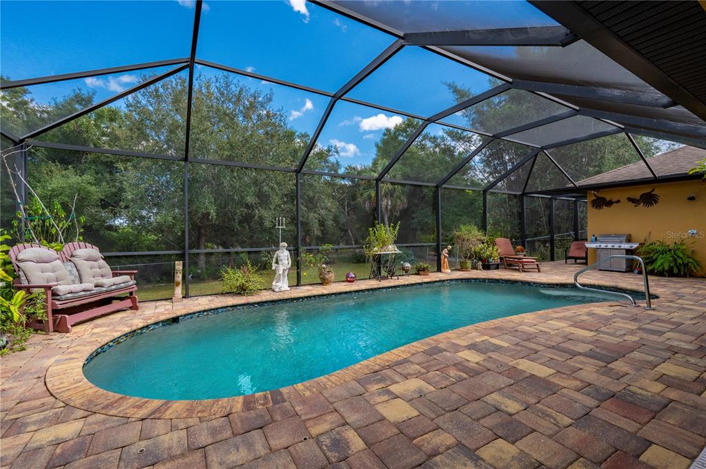 38881 Washington Loop Road Punta Gorda, FL 33982 - Photo 37 of 63 a view of a swimming pool with a patio