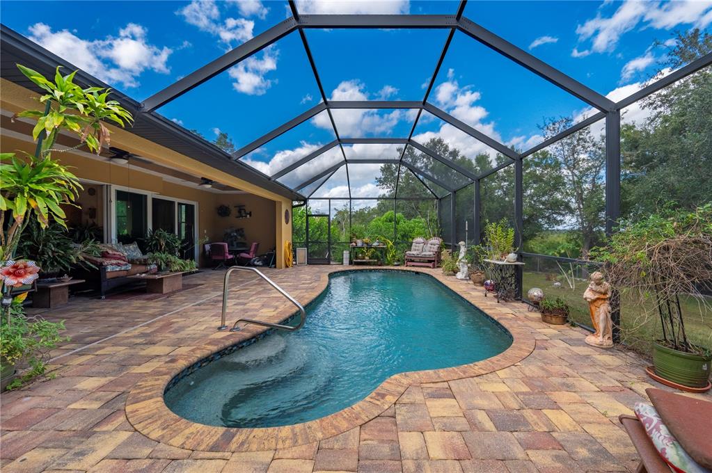 38881 Washington Loop Road Punta Gorda, FL 33982 - Photo 39 of 63 a view of a swimming pool with sitting area