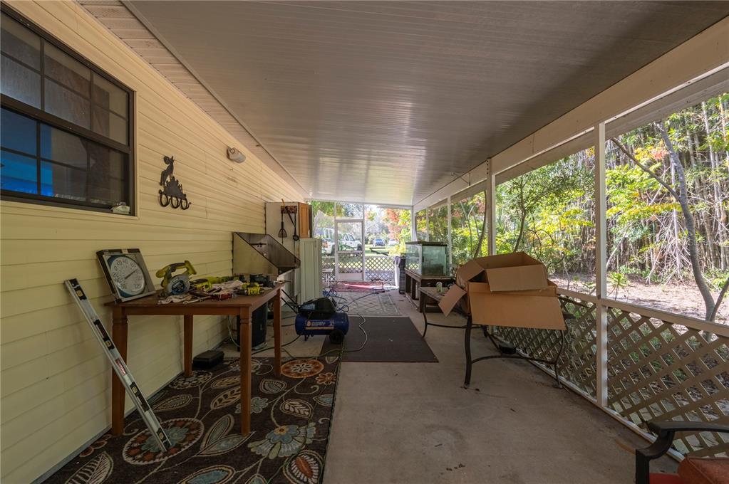 38881 Washington Loop Road Punta Gorda, FL 33982 - Photo 42 of 63 a view of a chairs and table in a patio