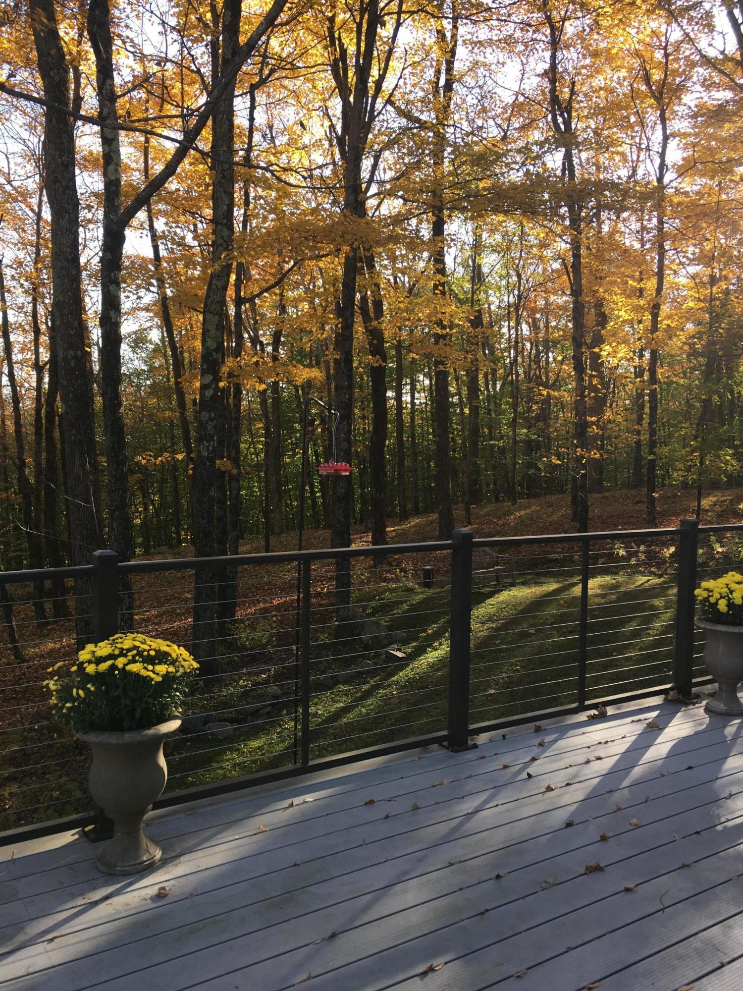 162 Stebbins Road Otis, MA 01253 - Photo 22 of 28 a view of a roof deck with wooden floor and city view
