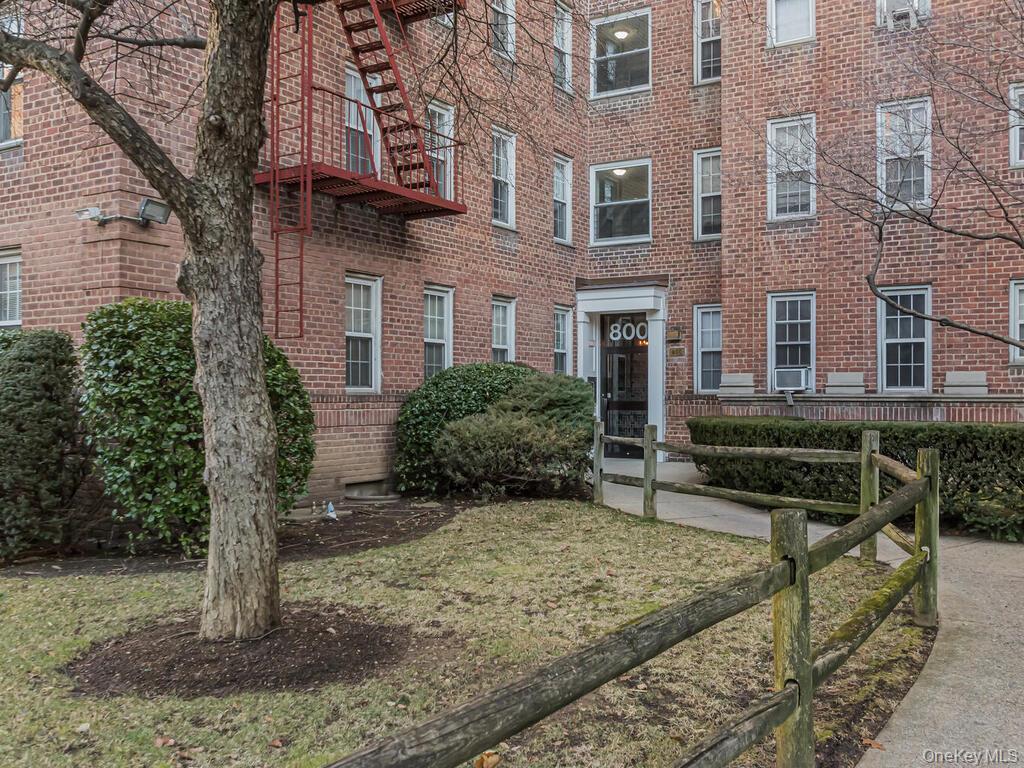800 Bronx River Road, Unit A12 Bronxville, NY 10708 - Photo 1 of 14 a view of a house with backyard and trees