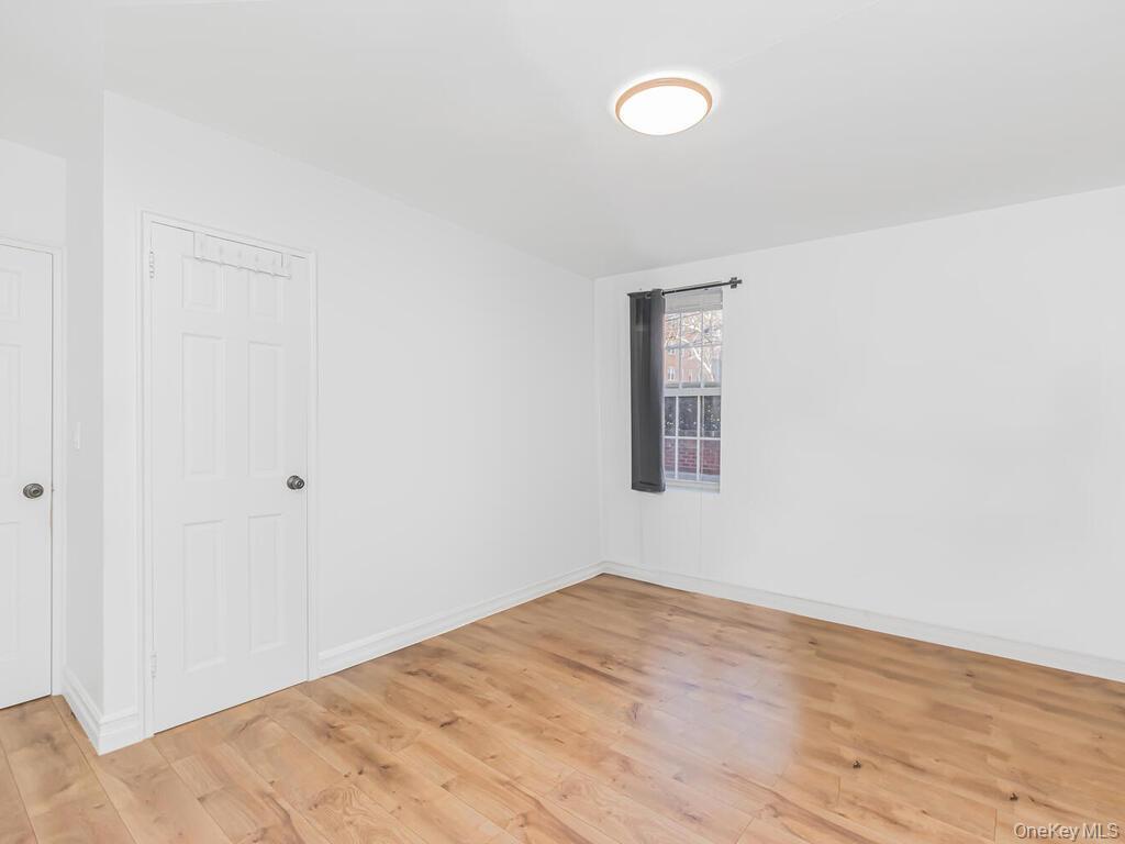 800 Bronx River Road, Unit A12 Bronxville, NY 10708 - Photo 11 of 14 a view of a big room with wooden floor and windows