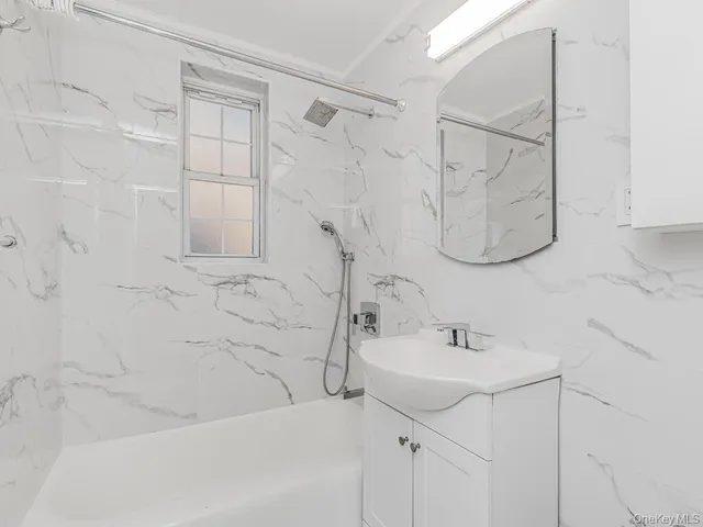 a bathroom with a sink and a shower