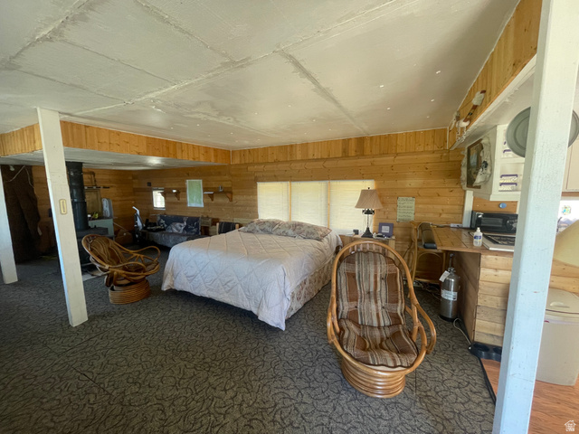 4648 West Taylor Flt Road Salina, UT 84654 - Photo 4 of 20 Spacious room featuring wood-finish wall paneling and a light-colored ceiling