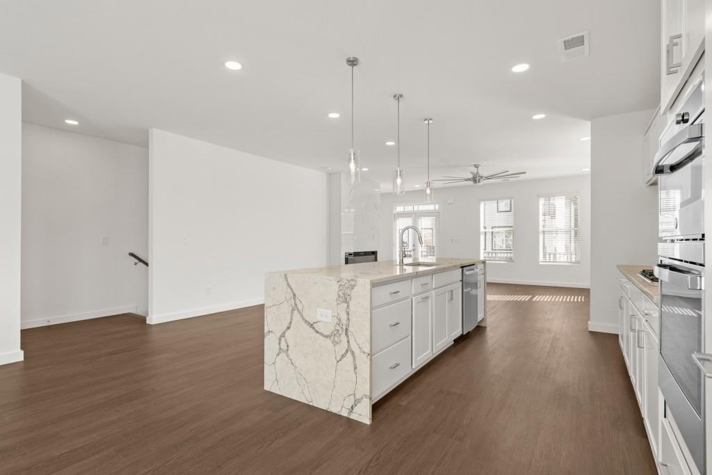 1078 Glen Opal Drive Decatur, GA 30032 - Photo 14 of 40 a large white kitchen with lots of counter space wooden floor and windows