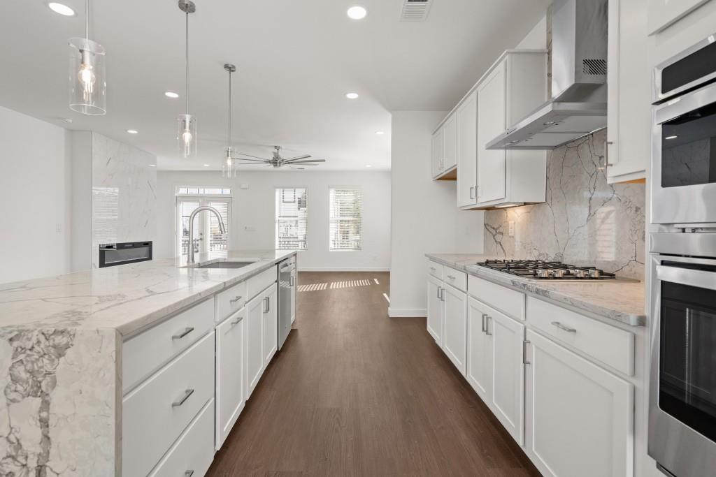 1078 Glen Opal Drive Decatur, GA 30032 - Photo 15 of 40 a large kitchen with cabinets and a stove top oven