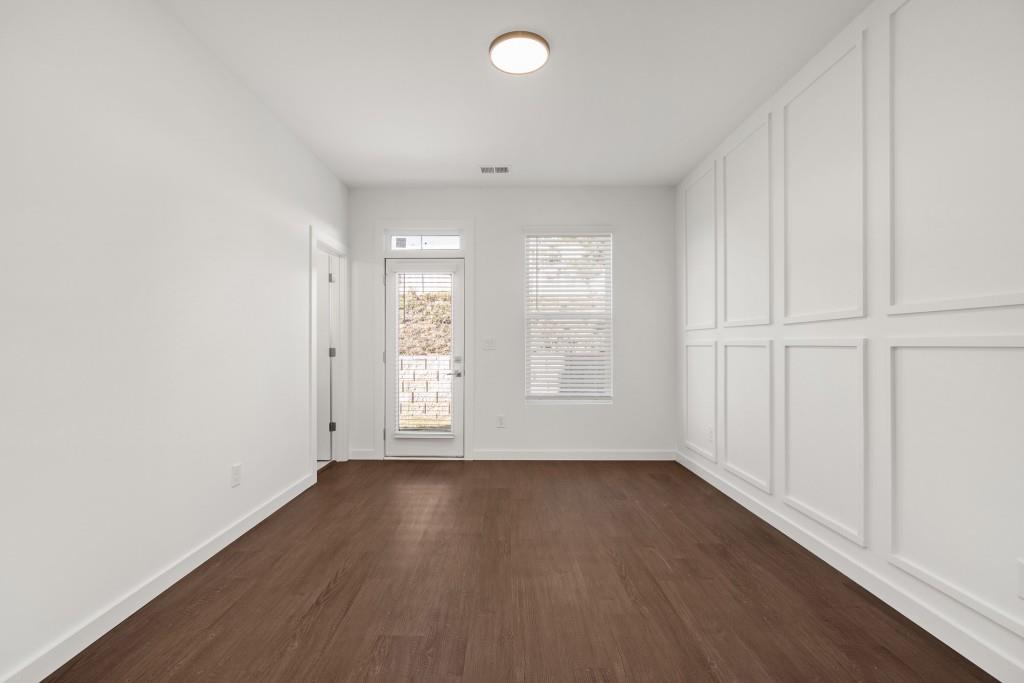 1078 Glen Opal Drive Decatur, GA 30032 - Photo 20 of 40 an empty room with wooden floor and windows